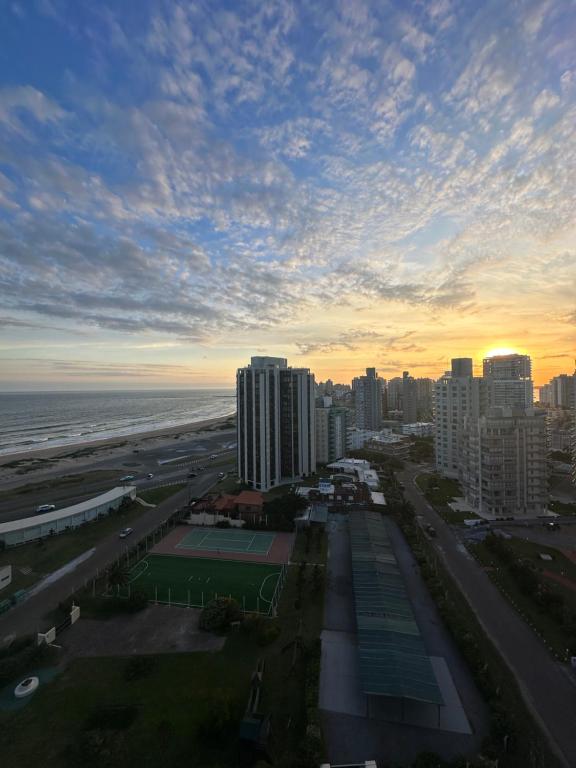 a view of a city with the ocean and buildings at Piso 14, Espectaular! in Punta del Este