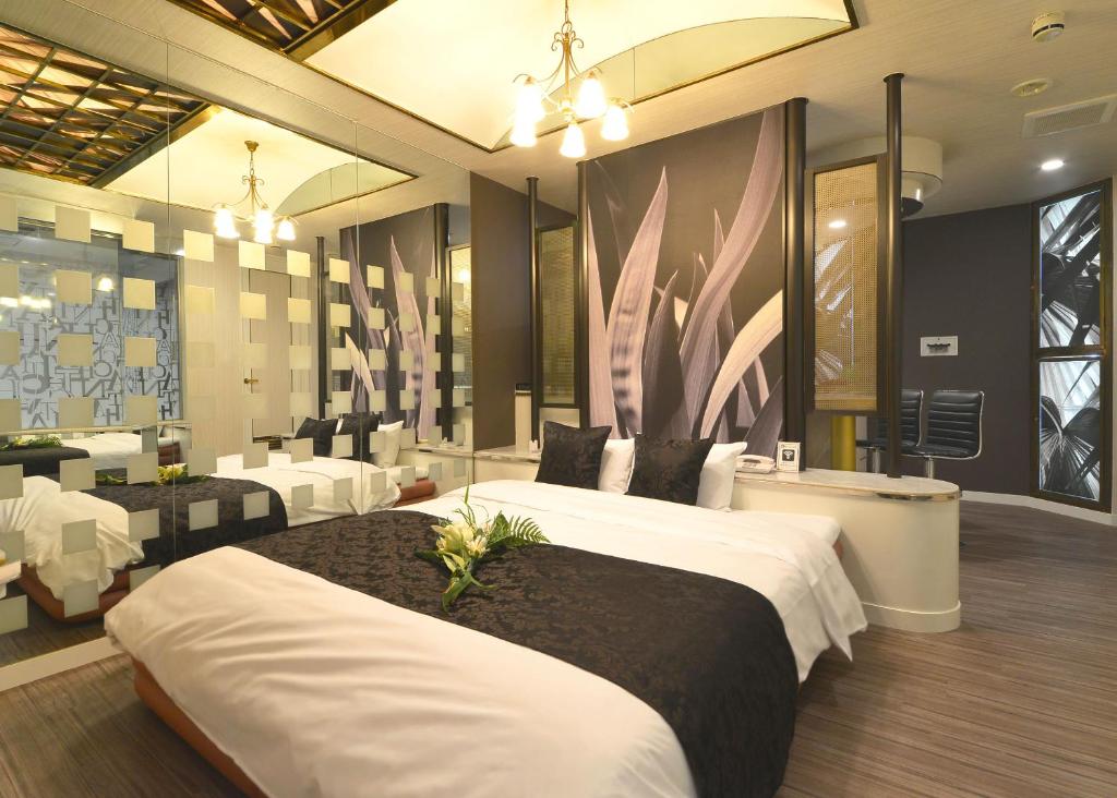 Postel nebo postele na pokoji v ubytování HOTEL CHANT - Adult Only 大人専用