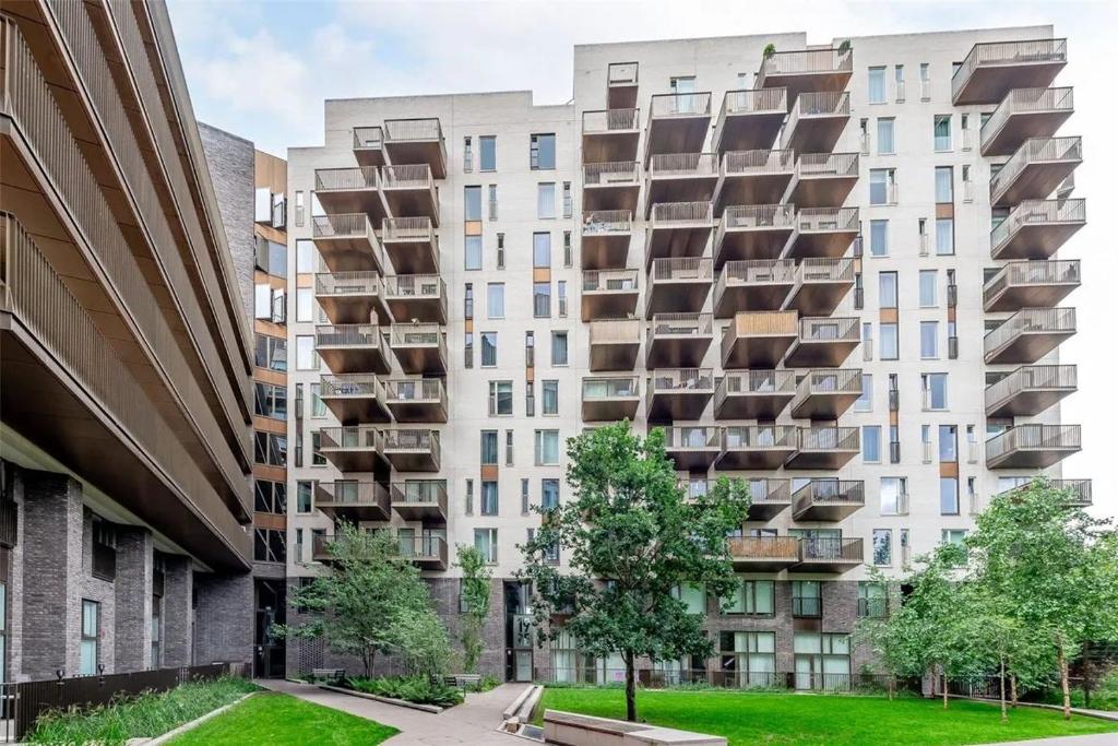 an apartment building with balconies on the side of it at The maud luxury garden in London