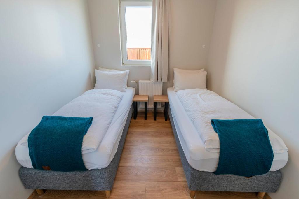 Rúm í herbergi á Stracta Hotel