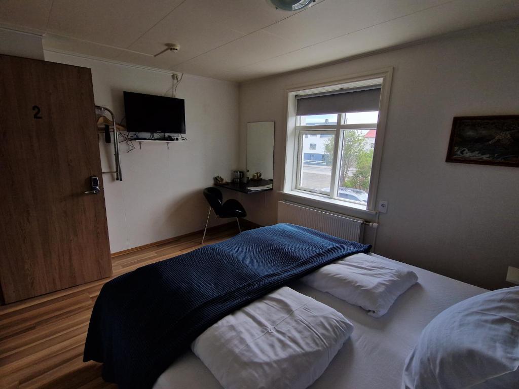 Postel nebo postele na pokoji v ubytování Guesthouse Mikael