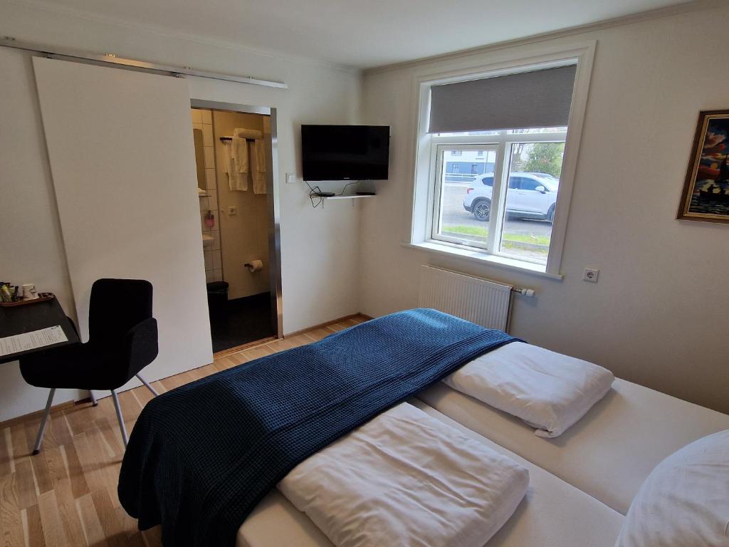 Postel nebo postele na pokoji v ubytování Guesthouse Mikael