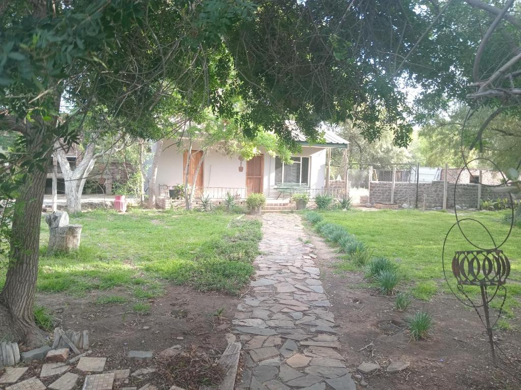 a stone path in front of a house at Royal Karoo Cottage in Beaufort West
