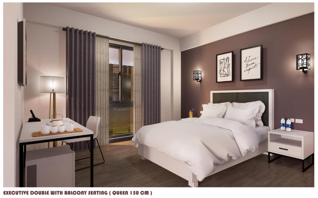 1 dormitorio con 1 cama blanca grande y escritorio en D'ELEMENTS HOTEL AND DORMITORY en Laoag