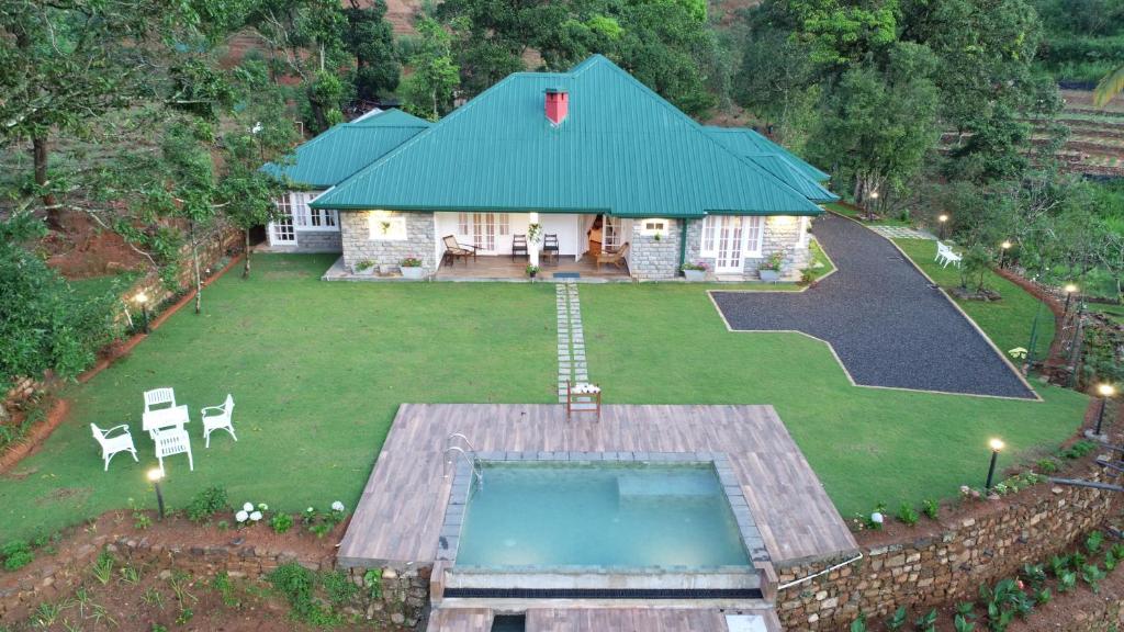an aerial view of a house with a swimming pool at Rockbourne Bungalow in Kandy