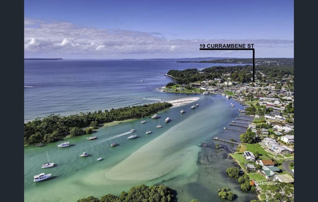 an aerial view of a beach with boats in the water at Husky 19 Beautifully Appointed Apartments - GREAT LOCATION - in the heart of Husky in Huskisson