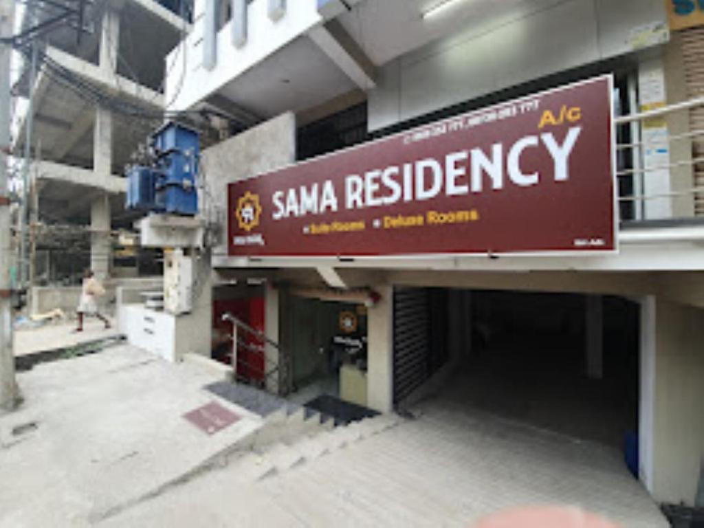 a building with a sign for a sna russian laboratory at SAMA RESIDENCY,Mancherial in Mancherāl