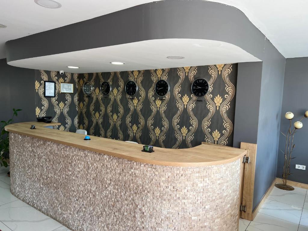 a bar in a room with a wall with skulls at Garden park Suit in Beylikduzu