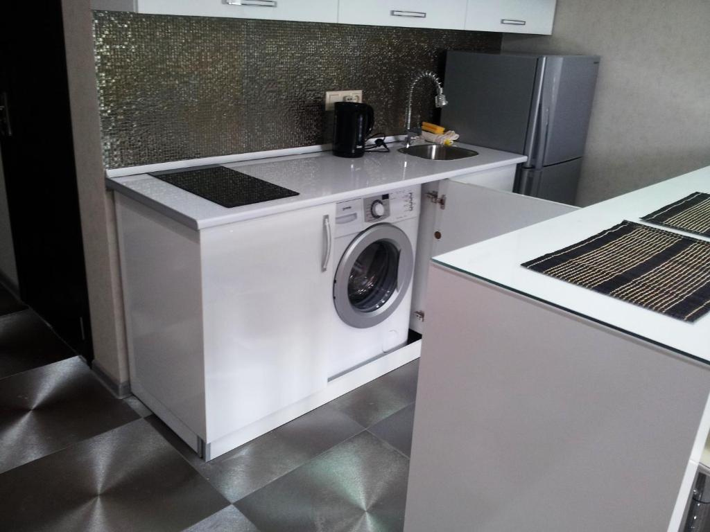 Kuchyň nebo kuchyňský kout v ubytování Sebi Apartment Batumi Towers