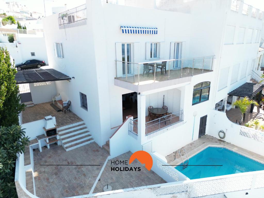 an aerial view of a house with a swimming pool at #185 Private Marina and Ocean View with Pool in Albufeira
