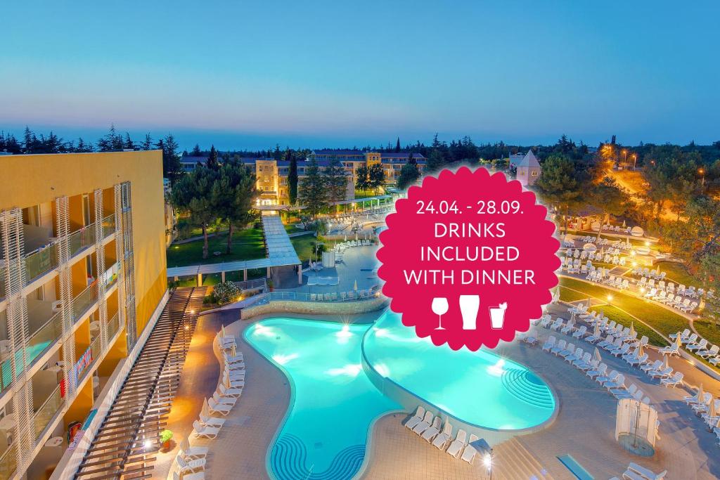 a sign that reads drinks included with dinner at a resort at Hotel Garden Istra Plava Laguna in Umag