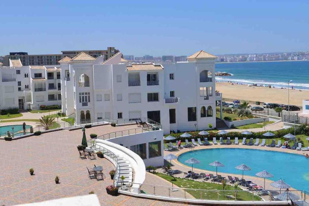 a view of a resort with a water slide at Moderne appart résidence privée in Tangier