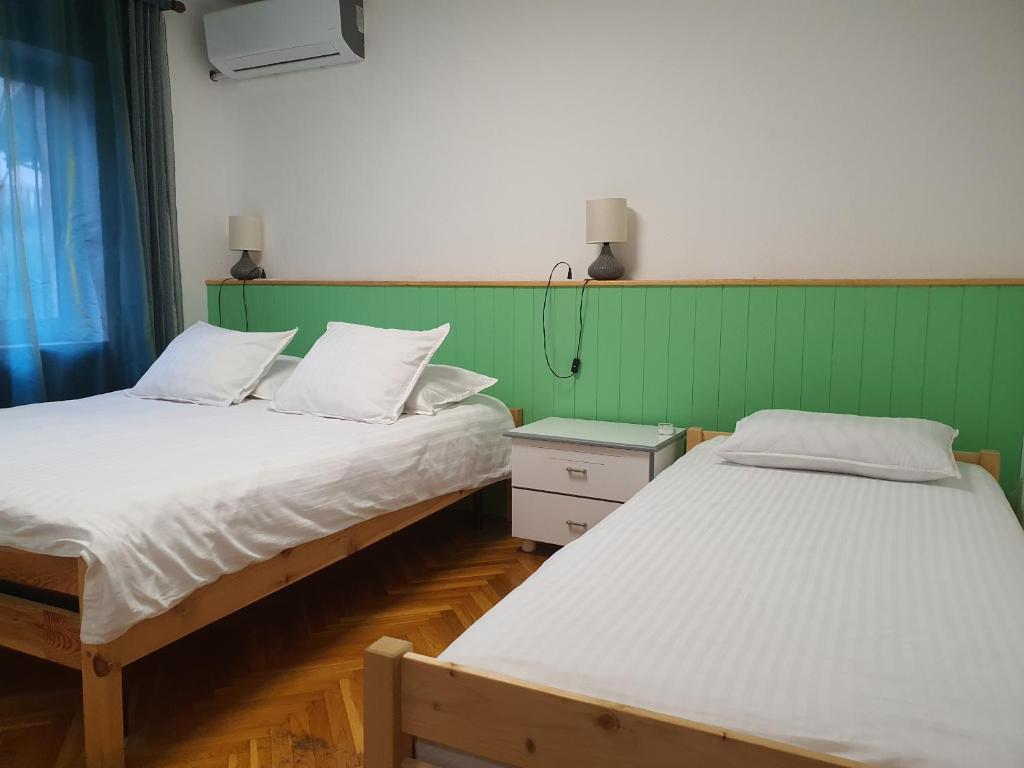 Cama o camas de una habitación en Central Home Away From Home