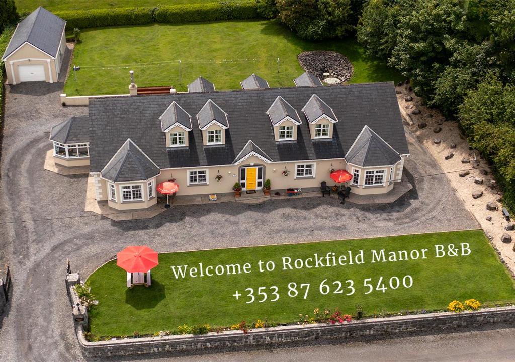 a large house with a welcome to rockford marker bbb at Rockfield Manor B&B, Knock in Knock