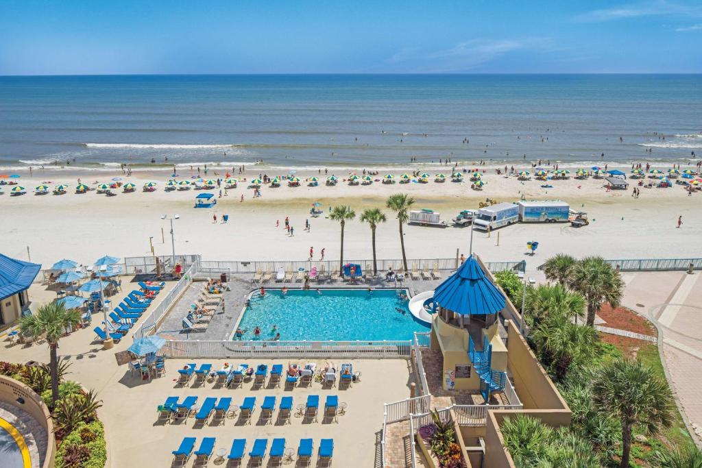 an aerial view of a pool and the beach at Hilton Vacation Club Daytona Beach Regency in Daytona Beach