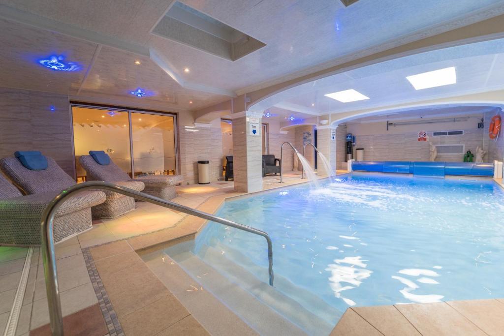 a large indoor swimming pool in a hotel at Atlantic Hotel in Tenby