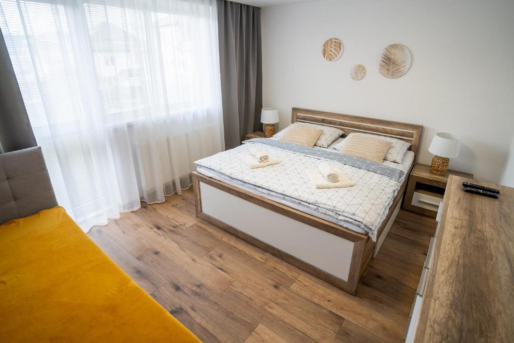 Postel nebo postele na pokoji v ubytování Apartmany ROSTER