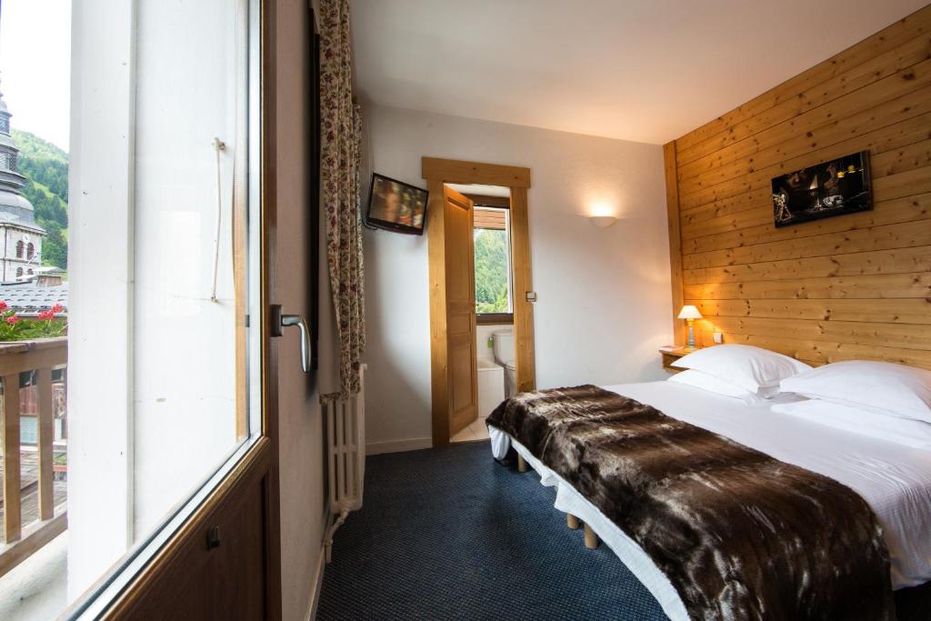 Postel nebo postele na pokoji v ubytování Hotel Christiania