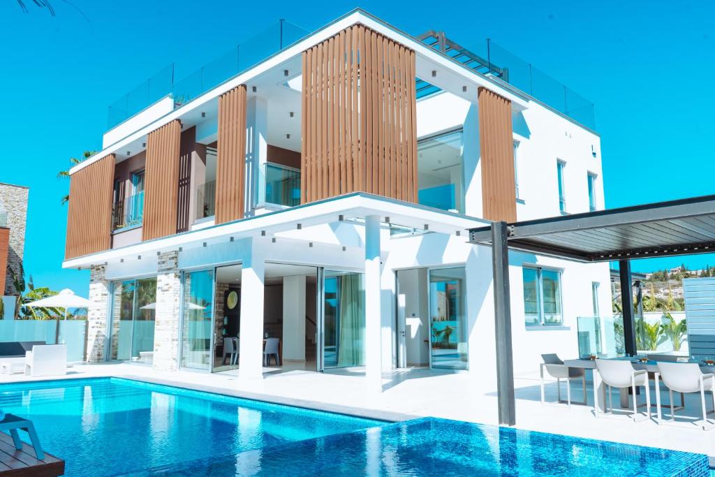 an image of a house with a swimming pool at Vivo Mare Beachfornt Villas - Azure in Ayia Napa