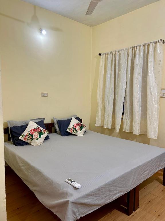 Postel nebo postele na pokoji v ubytování Anjunapalms GuestHouse