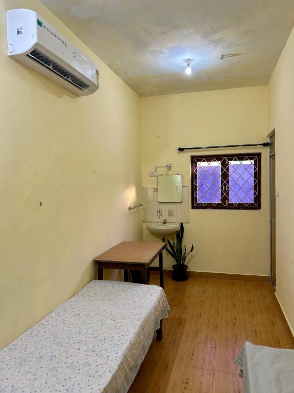 Postel nebo postele na pokoji v ubytování Anjunapalms GuestHouse