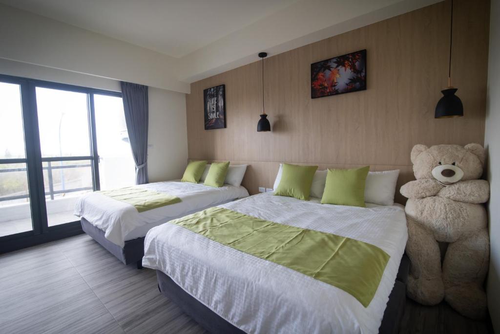 Postel nebo postele na pokoji v ubytování South of Penghu Homestay