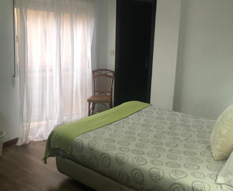 Cama o camas de una habitación en Hostal Victoria