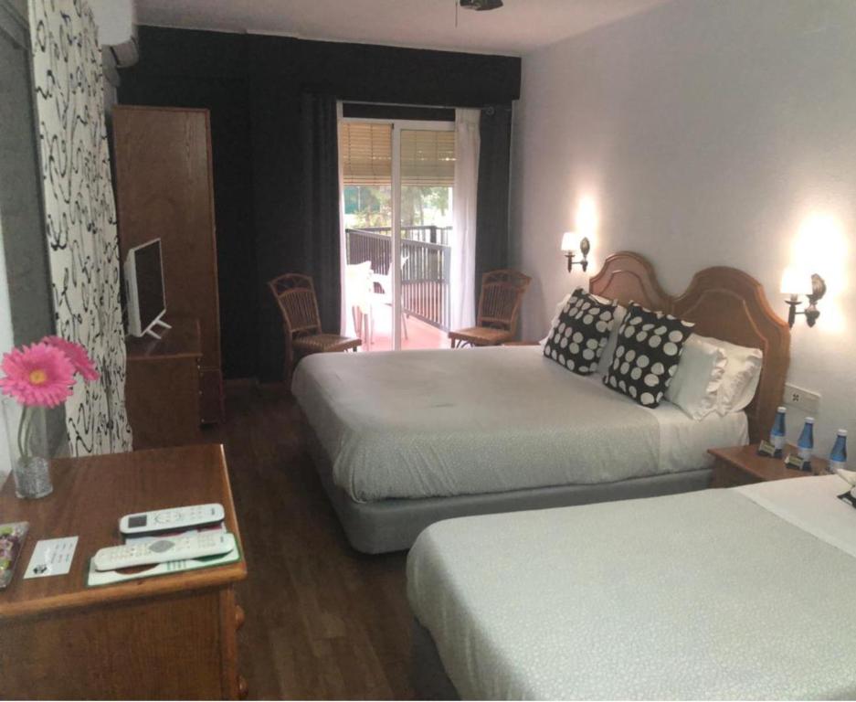 Cama o camas de una habitación en Hostal Victoria