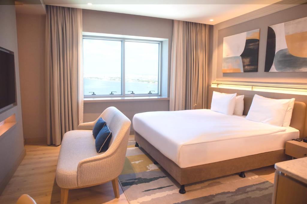 Postel nebo postele na pokoji v ubytování Kolin Hotel Spa & Convention Center