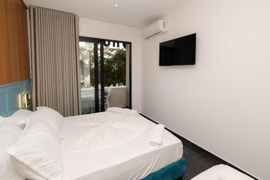 Postel nebo postele na pokoji v ubytování Aglon Twin's Hotel
