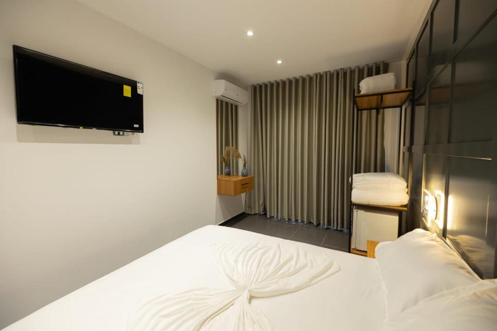 Postel nebo postele na pokoji v ubytování Aglon Twin's Hotel