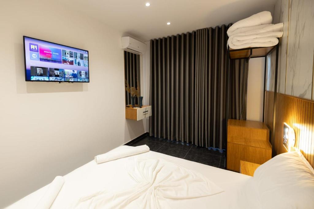 Postel nebo postele na pokoji v ubytování Aglon Twin's Hotel