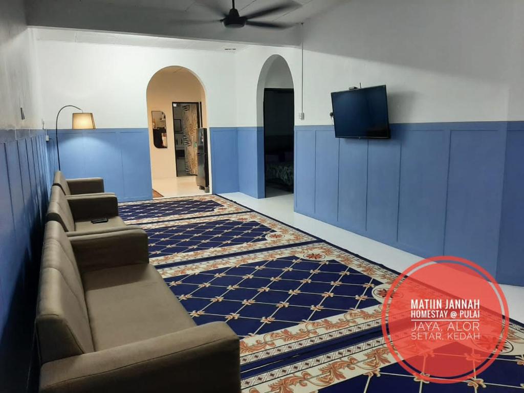 Χώρος καθιστικού στο MATIINJANNAH HOMESTAY