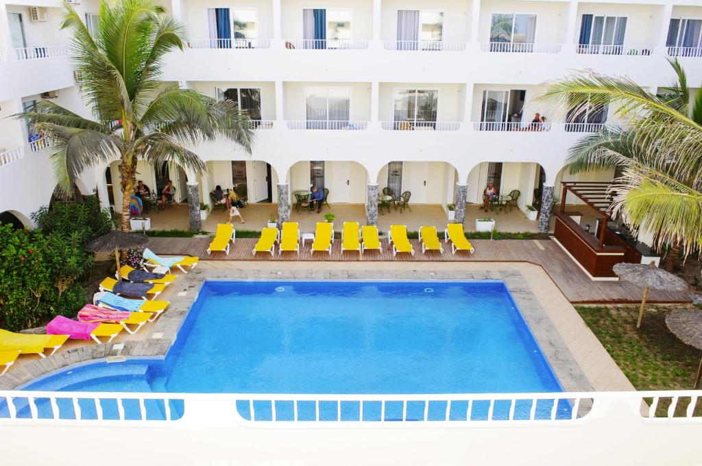 an aerial view of a hotel with a pool and chairs at Ouril Pontao Hotel in Santa Maria