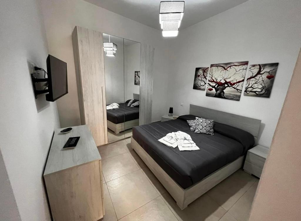 Un pat sau paturi într-o cameră la La Cupola - casa vacanze