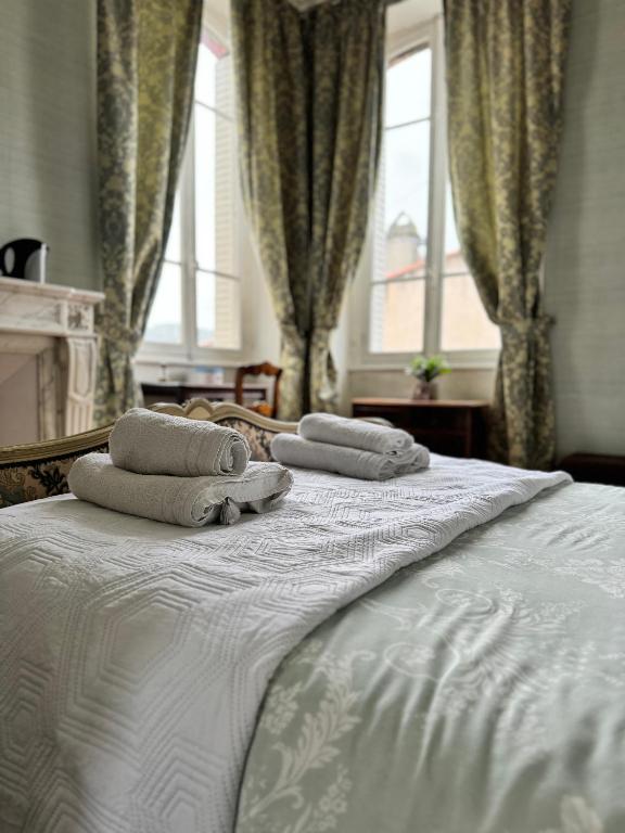 Cama o camas de una habitación en La Maison d'hôtes du Chapelier