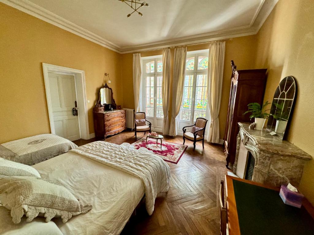 Cama o camas de una habitación en La Maison d'hôtes du Chapelier