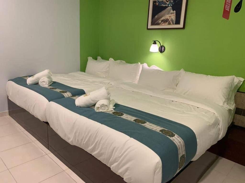 Postel nebo postele na pokoji v ubytování R Hotel Langkawi