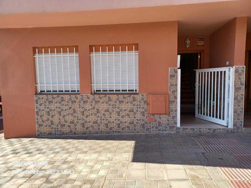 a house with a gate in front of it at Habitaciones Gioly in Puerto del Rosario