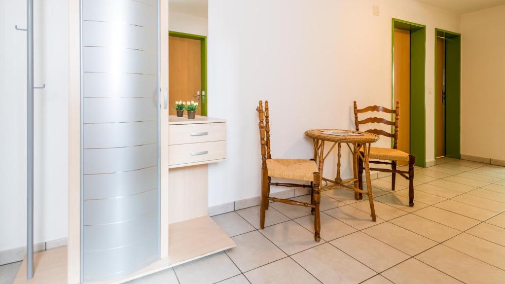 Kuchyň nebo kuchyňský kout v ubytování Apartments Atlas