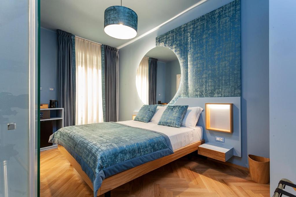 Кровать или кровати в номере Le Texture Premium Rooms Duomo-Cordusio