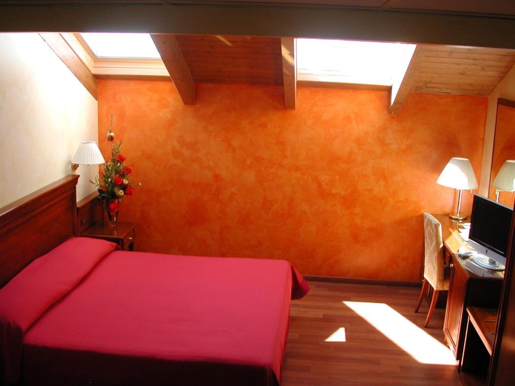 Un ou plusieurs lits dans un hébergement de l'établissement Hotel Vazzana