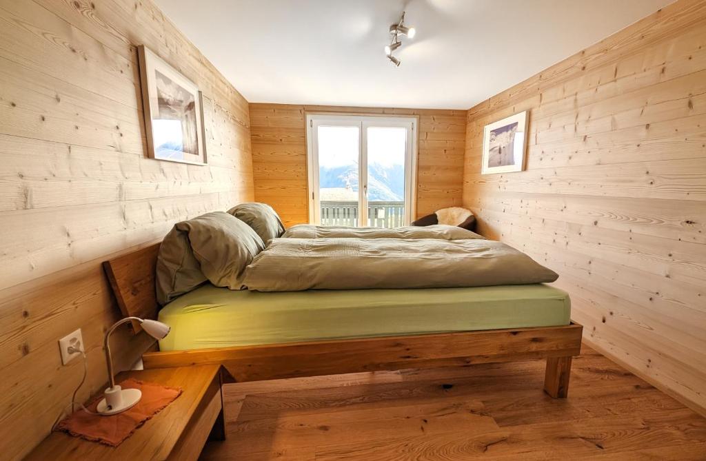 Una cama o camas en una habitación de Imhof Alpine B&B Apartments
