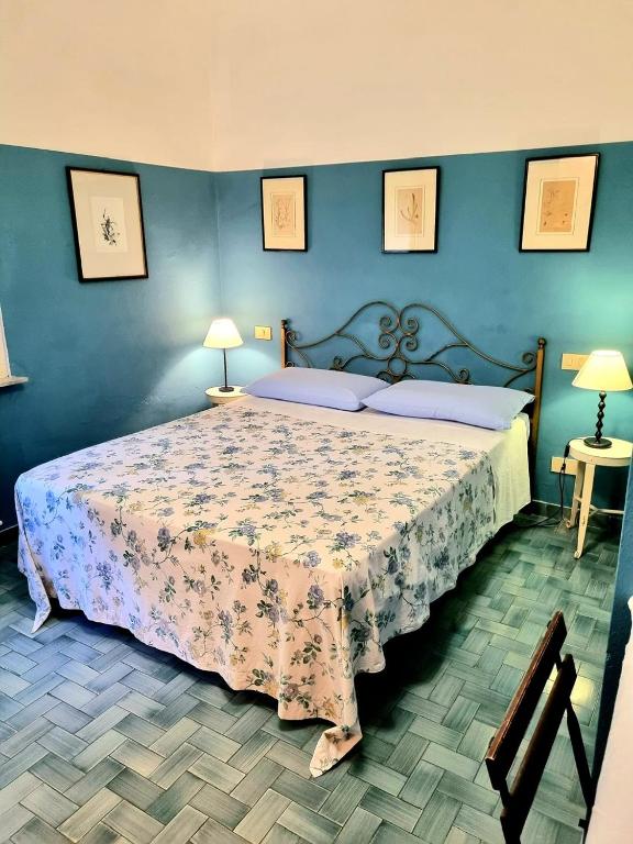 Łóżko lub łóżka w pokoju w obiekcie Casa Cambini