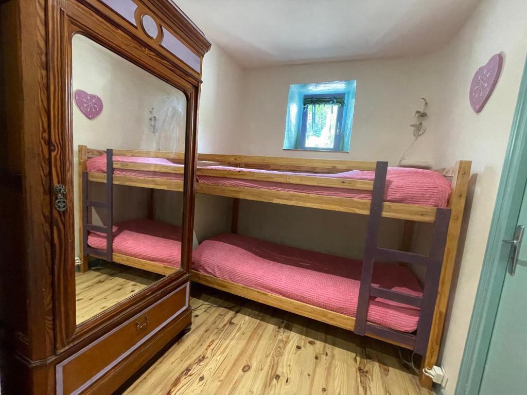 Postel nebo postele na pokoji v ubytování Petit Château