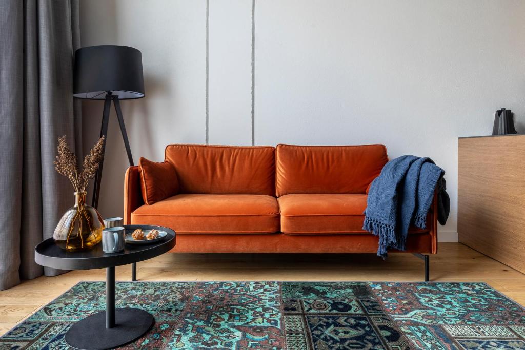 Posezení v ubytování Stylish loft with terrace Paupys, Old town