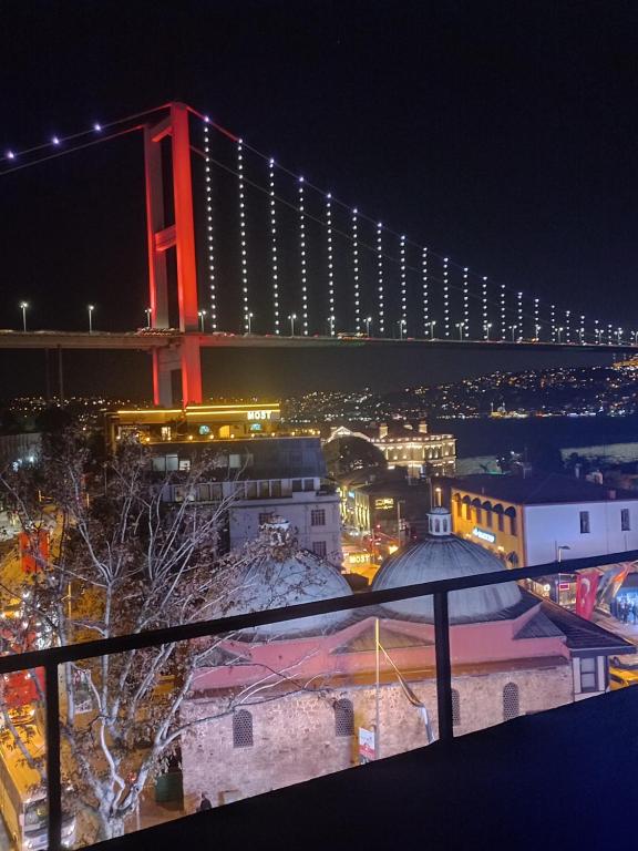 a view of a large bridge at night at Studio meublé in Istanbul