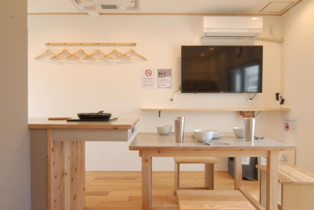 a room with two tables and a flat screen tv at futaba heights - Vacation STAY 15415 in Tokyo