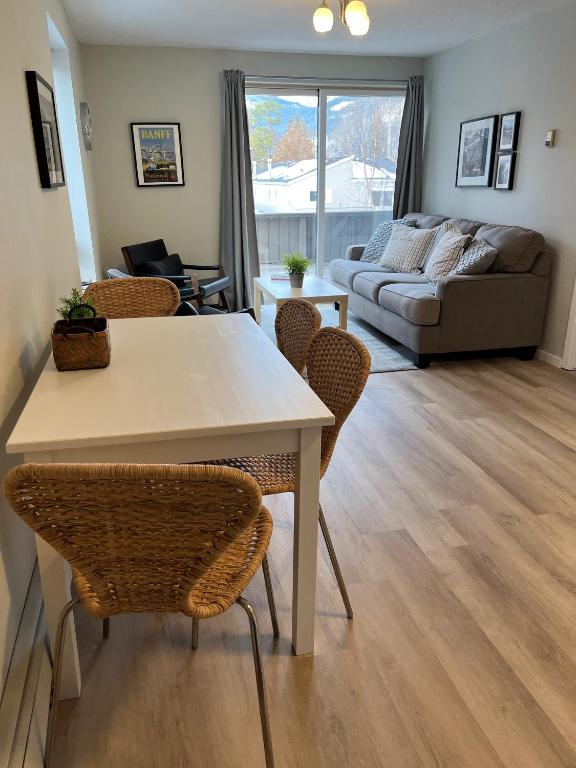 a living room with a table and chairs and a couch at Mountain View Bed & Breakfast in Banff