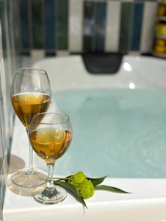 two glasses of wine sitting on a table at Dem Premium Hotel - Round Trip Airport Service - Istanbul International Airport in Arnavutköy